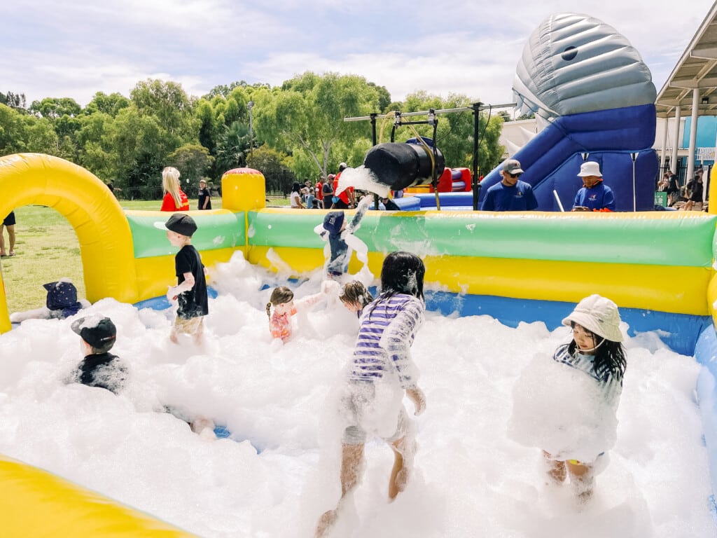 Swan Inflatables 2024. Children playing in an inflatable foam pit.